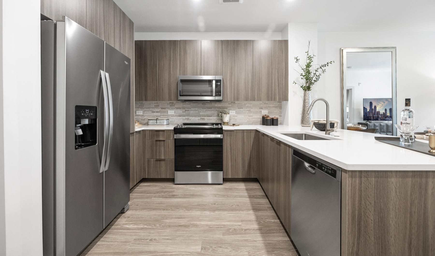 a kitchen with a refrigerator and a microwave