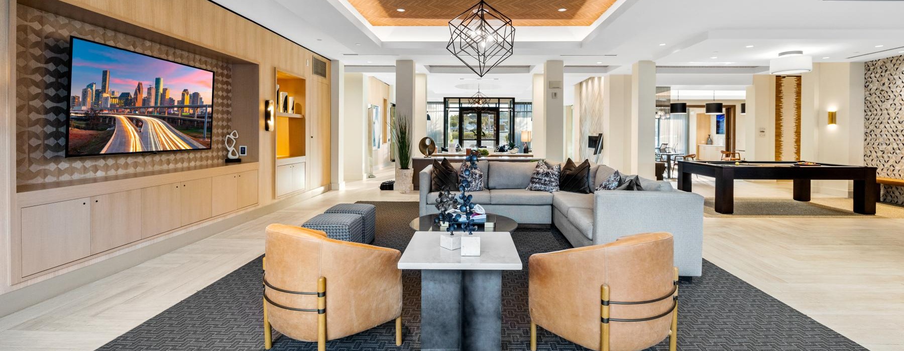 a living room with a chandelier and a couch